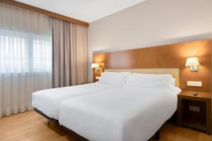 Postel nebo postele na pokoji v ubytování B&B HOTEL Logroño Las Cañas
