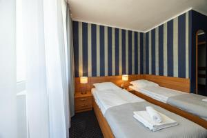 Postel nebo postele na pokoji v ubytování Baltic Inn
