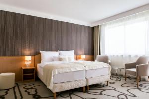 Posteľ alebo postele v izbe v ubytovaní Ambient Hotel & Thermal Spa