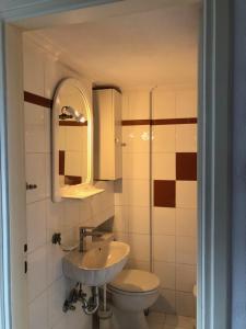 a bathroom with a sink and a toilet at Villa Hydra Estrella in Hydra