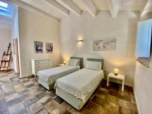 A bed or beds in a room at Al Teatro di Tavignano