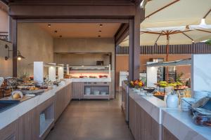 a large kitchen with lots of counter tops at Hotel Pyriá in Hersonissos