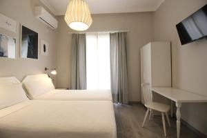 Posteľ alebo postele v izbe v ubytovaní Las Atarazanas - Design Hostal
