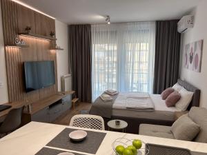 Postel nebo postele na pokoji v ubytování V Park Lux Apartman