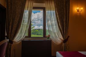 Foto San Gimignanos asuva majutusasutuse Torciano Hotel Wine & Winery, Tuscany galeriist