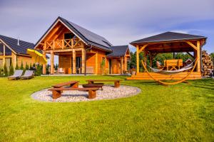 Zahrada ubytování Przystanek MAZURY - domki nad jeziorem