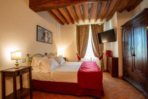 Voodi või voodid majutusasutuse Torciano Hotel Wine & Winery, Tuscany toas