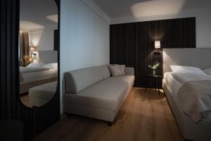 Ένα ή περισσότερα κρεβάτια σε δωμάτιο στο Hotel Schachner