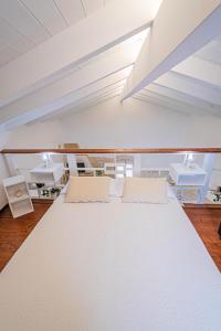 A bed or beds in a room at HISTORIA- Dimore Vico Ghezzi