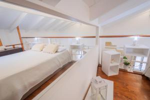 A bed or beds in a room at HISTORIA- Dimore Vico Ghezzi