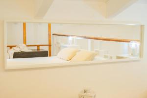 A bed or beds in a room at HISTORIA- Dimore Vico Ghezzi