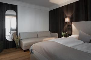 Ένα ή περισσότερα κρεβάτια σε δωμάτιο στο Hotel Schachner