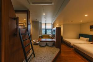 Voodi või voodid majutusasutuse Hotel Vison toas