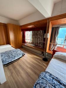 Postel nebo postele na pokoji v ubytování Appartamento Sole Alto
