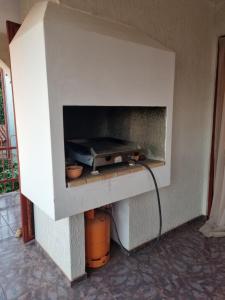 a brick oven with a pizza in it at Apartments Jelena in Peroj