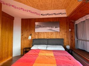 Postel nebo postele na pokoji v ubytování Appartamento Sole Alto
