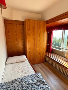 Postel nebo postele na pokoji v ubytování Appartamento Sole Alto