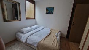 Postel nebo postele na pokoji v ubytování Room near University Campus in Sarajevo - Rooms Sarajevo