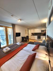 a bedroom with two beds and a living room at Levi Suites Levi Gold in Levi