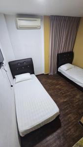 Kama o mga kama sa kuwarto sa Cute Hotel