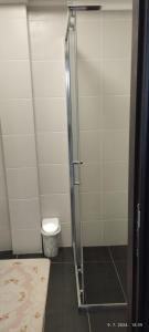 a shower stall in a bathroom with a toilet at CENTAR CEPERKOVIC in Vrnjačka Banja