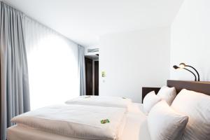 Postel nebo postele na pokoji v ubytování Tobbaccon Hotel + 20 fotografií