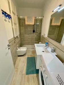 a bathroom with a sink and a toilet and a shower at Come stare sulla prua di una barca! in Giglio Porto +41 photos
