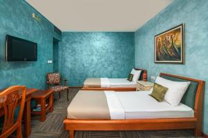 Uma cama ou camas num quarto em Hotel Kerber