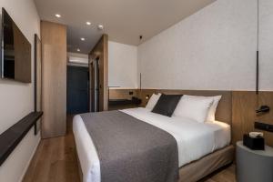 Ένα ή περισσότερα κρεβάτια σε δωμάτιο στο Evanik Chic Hotel