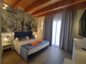 Postel nebo postele na pokoji v ubytování Hotel Villa Angelina + 146 fotografií