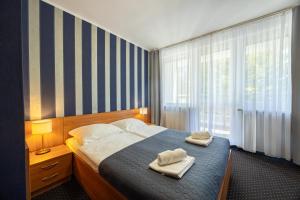 Postel nebo postele na pokoji v ubytování Baltic Inn