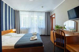 Postel nebo postele na pokoji v ubytování Baltic Inn