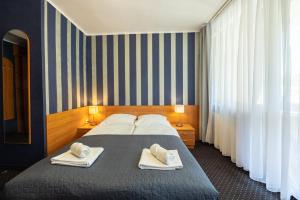 Postel nebo postele na pokoji v ubytování Baltic Inn