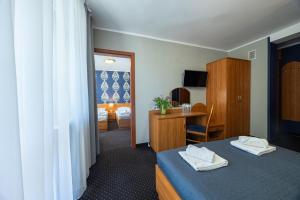 Postel nebo postele na pokoji v ubytování Baltic Inn