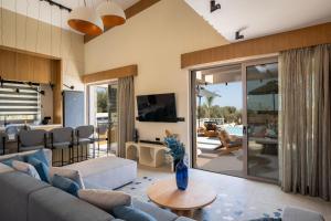 a living room with a couch and a table at Bliss Villas in Rethymno Town