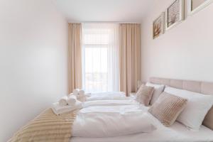 Ένα ή περισσότερα κρεβάτια σε δωμάτιο στο Apartament Blue Sky z Basenem Letnim by HolidaySun +29 φωτογραφίες