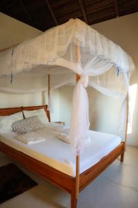 Postel nebo postele na pokoji v ubytování Kategha Beach Guesthouse + 26 fotografií