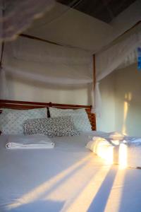 Postel nebo postele na pokoji v ubytování Kategha Beach Guesthouse
