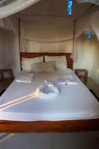 Postel nebo postele na pokoji v ubytování Kategha Beach Guesthouse