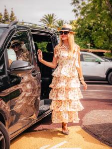 a woman is getting out of a car at Domaine de l'Astragale in Saint-Tropez