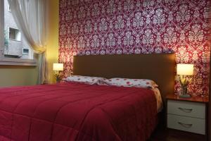 Postel nebo postele na pokoji v ubytování B&B Sant'Agostino