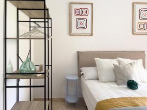 a bedroom with a bed and a book shelf at RosaritoHomes in Madrigal de la Vera +17 photos
