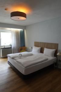 Postel nebo postele na pokoji v ubytování Hotel Birnbaum