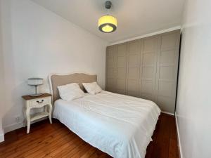 Postel nebo postele na pokoji v ubytování Appartement Neuf Proche de Paris
