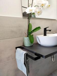 a bathroom with a sink and a mirror at Sa Paxi Arbus in Arbus