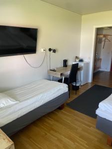 Postel nebo postele na pokoji v ubytování Hotell Smedjan