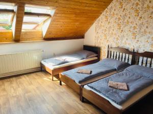 Postel nebo postele na pokoji v ubytování Penzion Trojna Lednice-vhodné na svatby,rodinné akce,teambuilding