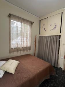 Postel nebo postele na pokoji v ubytování Ζαχάρω Suite