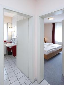 Postel nebo postele na pokoji v ubytování Posthotel Usseln