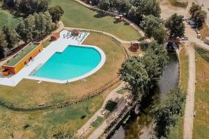 an overhead view of a swimming pool in a park at casa dos Ferreira no Douro in Ucanha